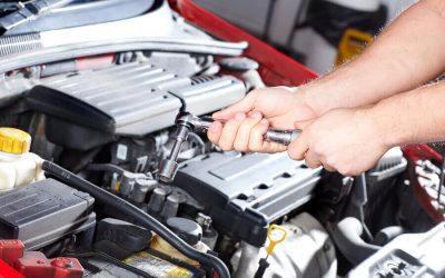 Auto-Repair-Mechanic-with-a-wrench-in-the-hood