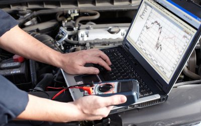 Professional car mechanic working in auto repair service.